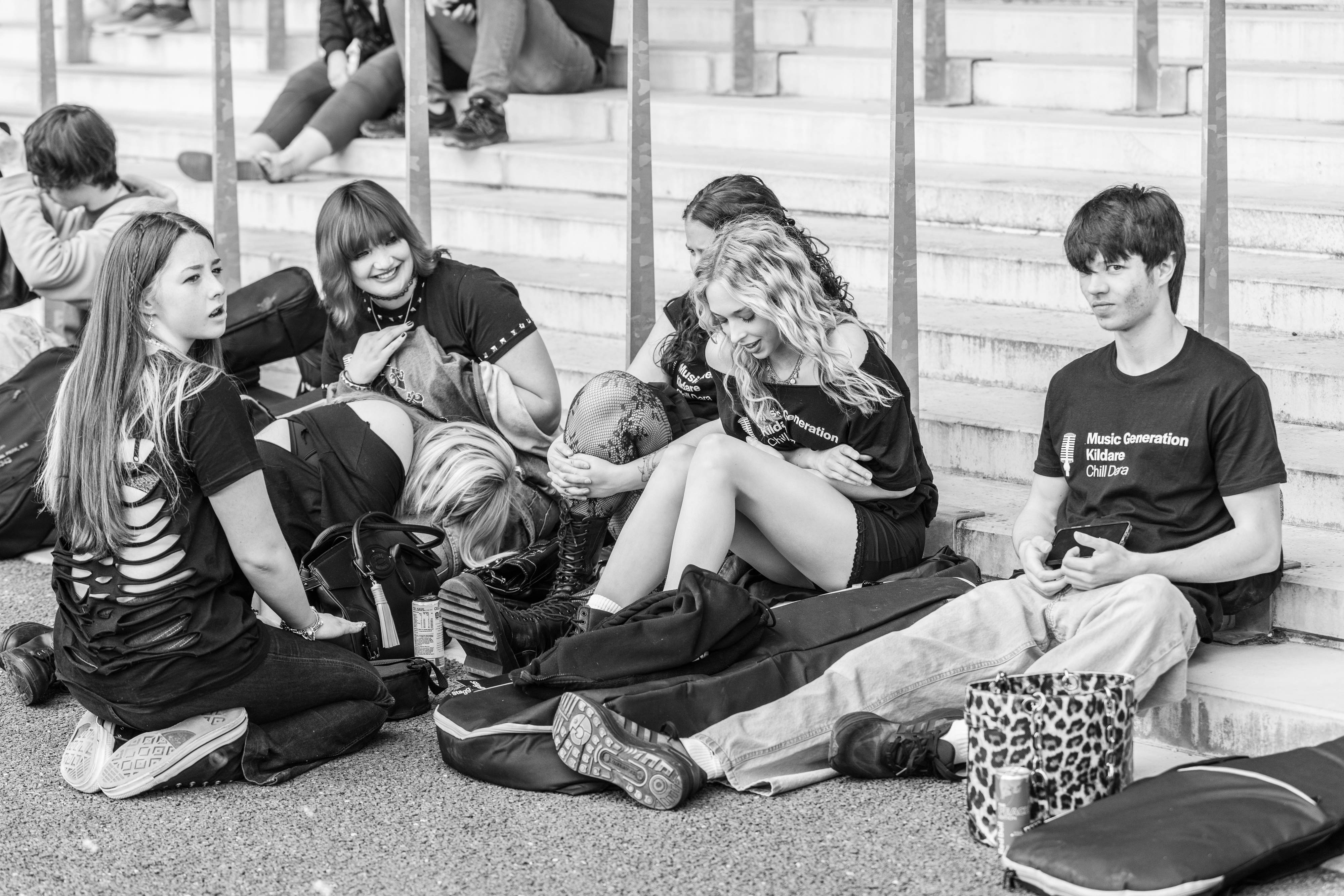 People sat on steps laughing. 